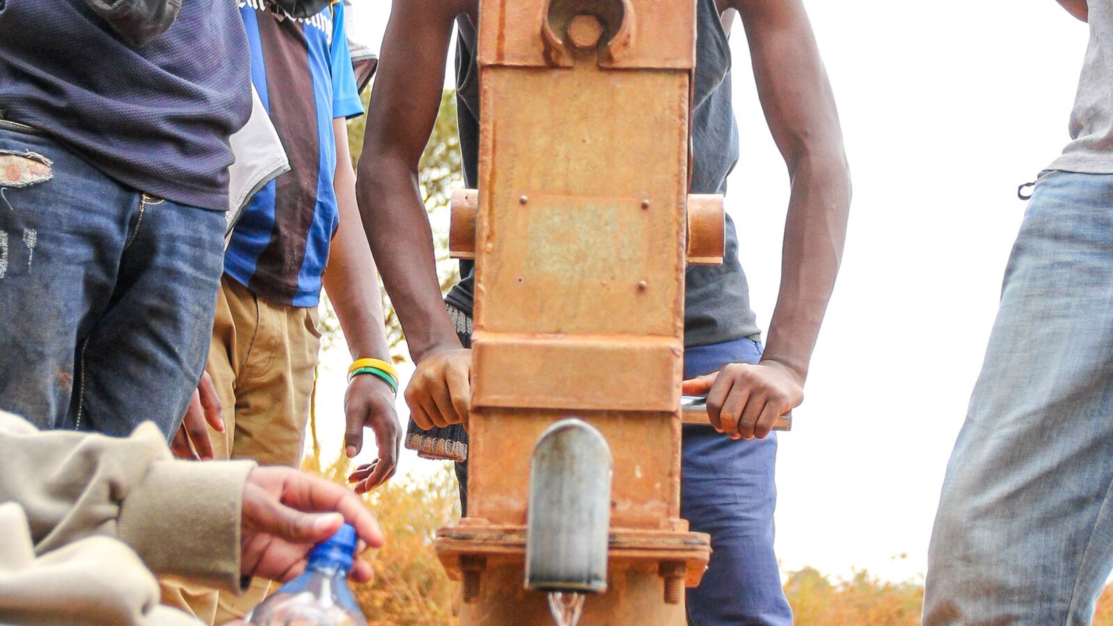 A community gathered around a new water well